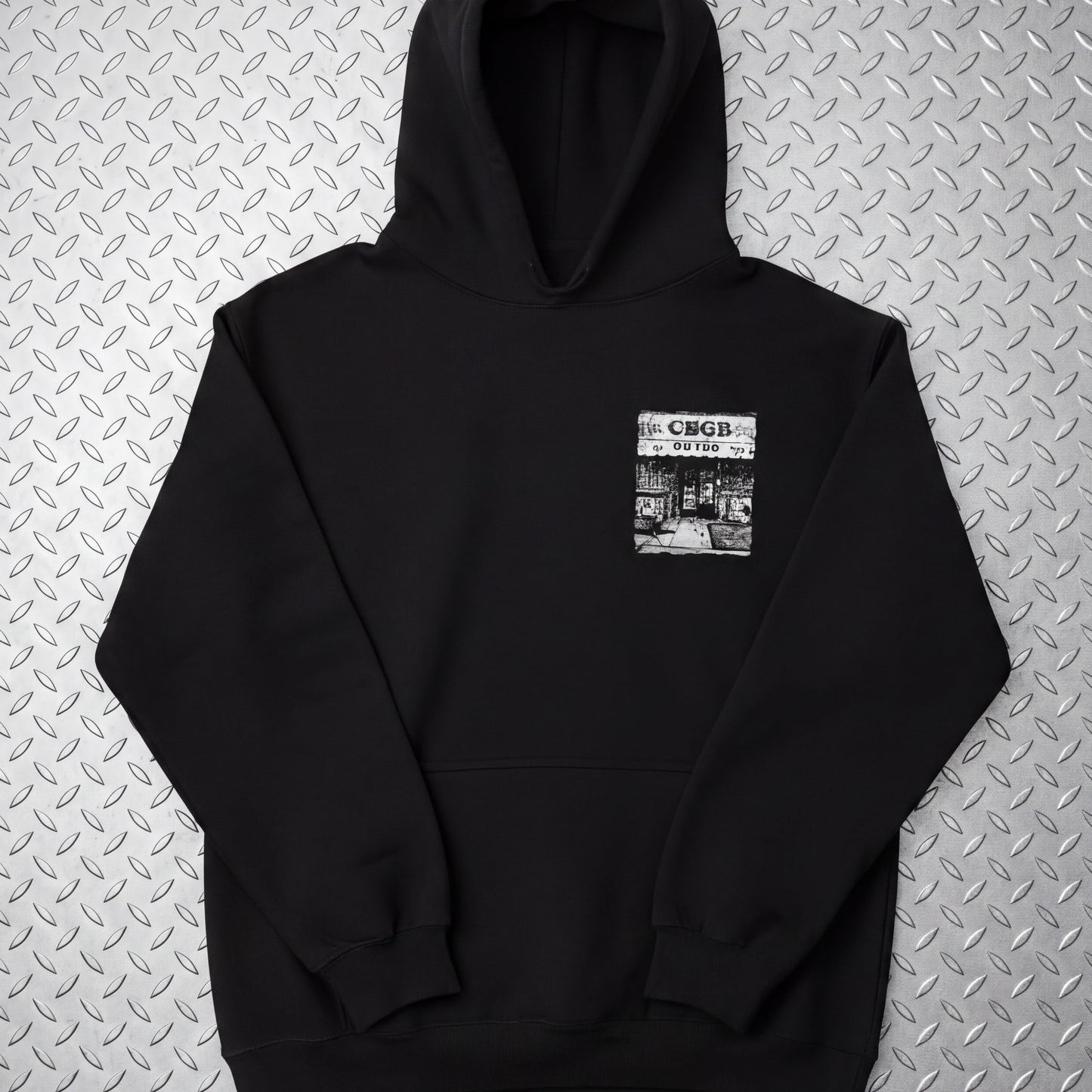 A black hoodie with a graphic design on the front pocket.