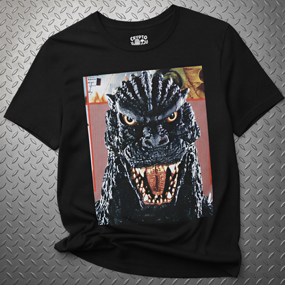 A black t-shirt with a graphic of a large, menacing-looking monster with a wide-open mouth and sharp teeth, giving it a menacing appearance.