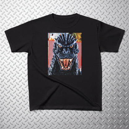 A black t-shirt with a graphic of a large, menacing-looking monster with a fierce expression and open mouth, set against a metallic background.