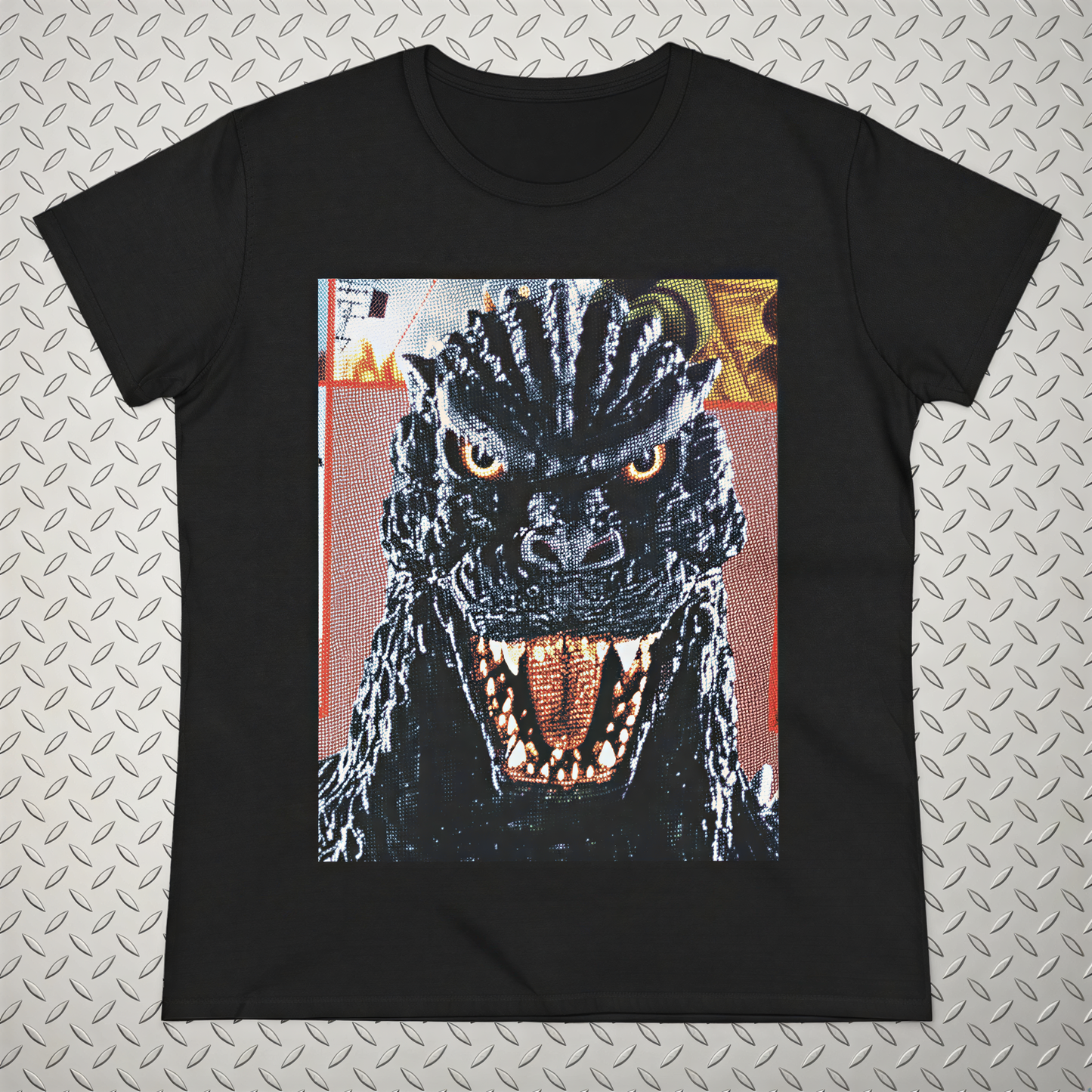 A black t-shirt with a close-up of a menacing-looking monster or dragon-like creature with sharp teeth and an intense expression.