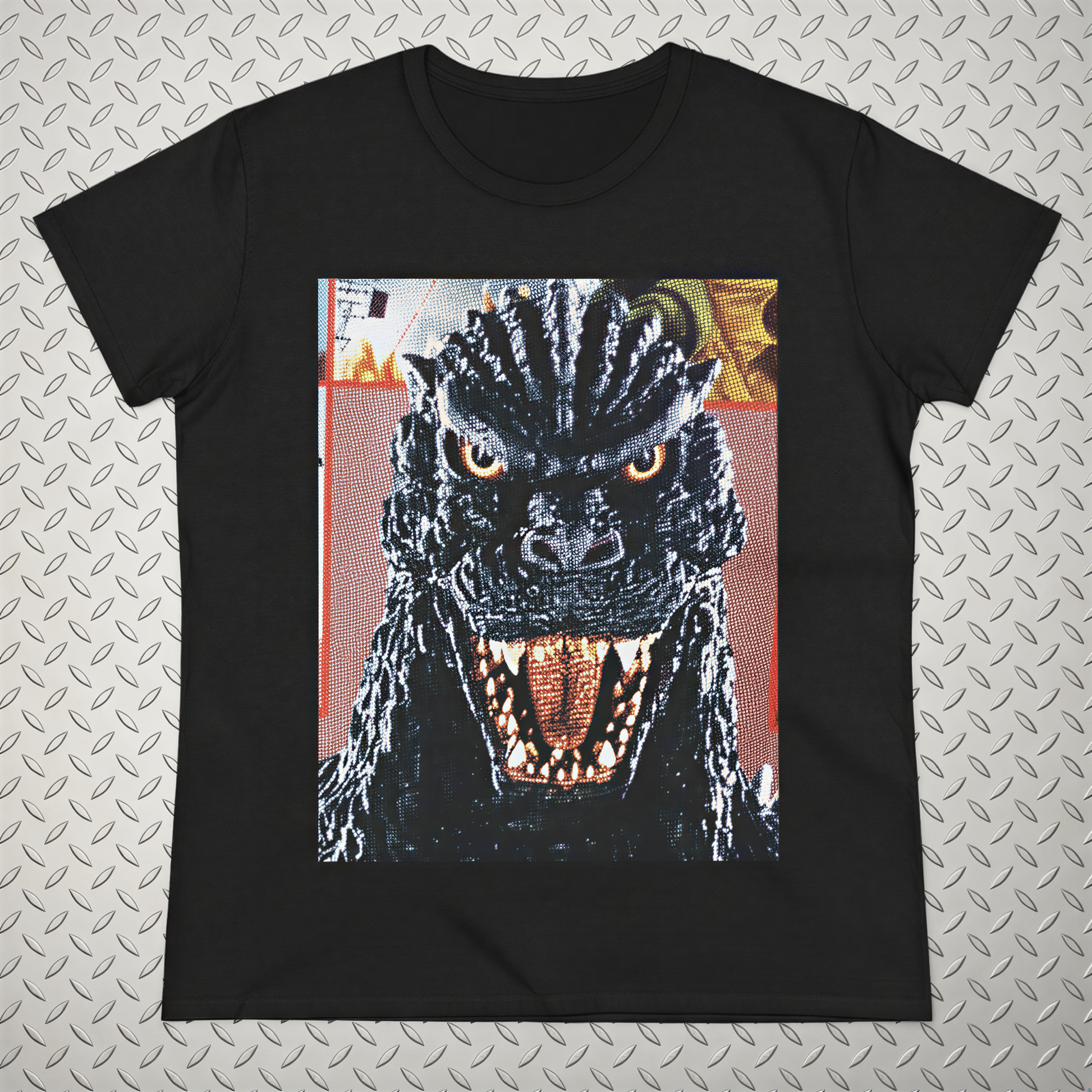 A black t-shirt with a close-up of a menacing-looking monster or dragon-like creature with sharp teeth and an intense expression.
