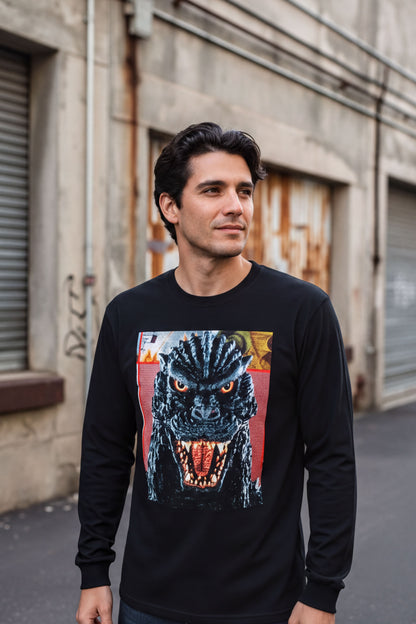 A man wearing a black long-sleeved shirt with a graphic of a large, menacing-looking monster on it.