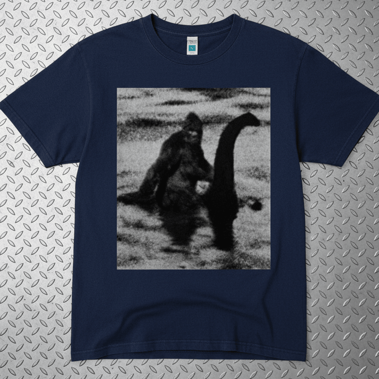 T-Shirt - Bigfoot Riding Nessie Shirt | Unisex Heavy Vintage - Unisex Lane Seven | Bigfoot, Cryptids, Retro & Vintage, Funny from SHIRT MONSTERS