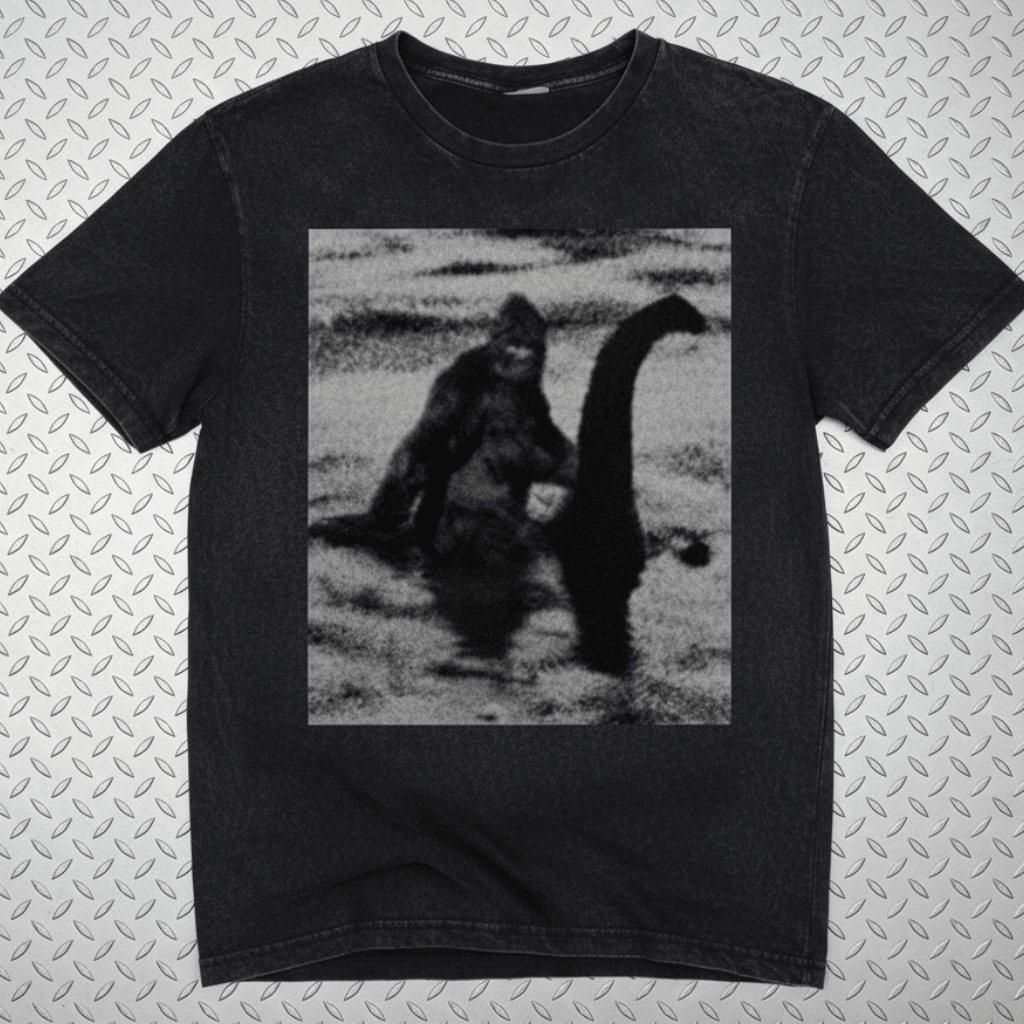 T-Shirt - Bigfoot Riding Nessie Shirt | Unisex Heavy Vintage - Unisex Lane Seven | Bigfoot, Cryptids, Retro & Vintage, Funny from SHIRT MONSTERS