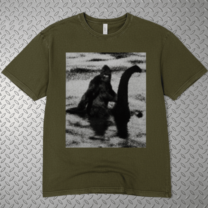 T-Shirt - Bigfoot Riding Nessie Shirt | Unisex Heavy Vintage - Unisex Lane Seven | Bigfoot, Cryptids, Retro & Vintage, Funny from SHIRT MONSTERS