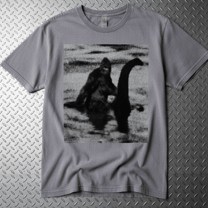 T-Shirt - Bigfoot Riding Nessie Shirt | Unisex Heavy Vintage - Unisex Lane Seven | Bigfoot, Cryptids, Retro & Vintage, Funny from SHIRT MONSTERS