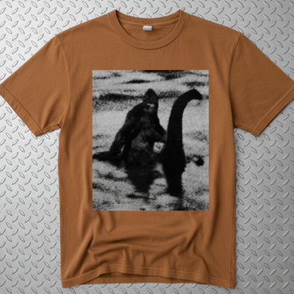 T-Shirt - Bigfoot Riding Nessie Shirt | Unisex Heavy Vintage - Unisex Lane Seven | Bigfoot, Cryptids, Retro & Vintage, Funny from SHIRT MONSTERS