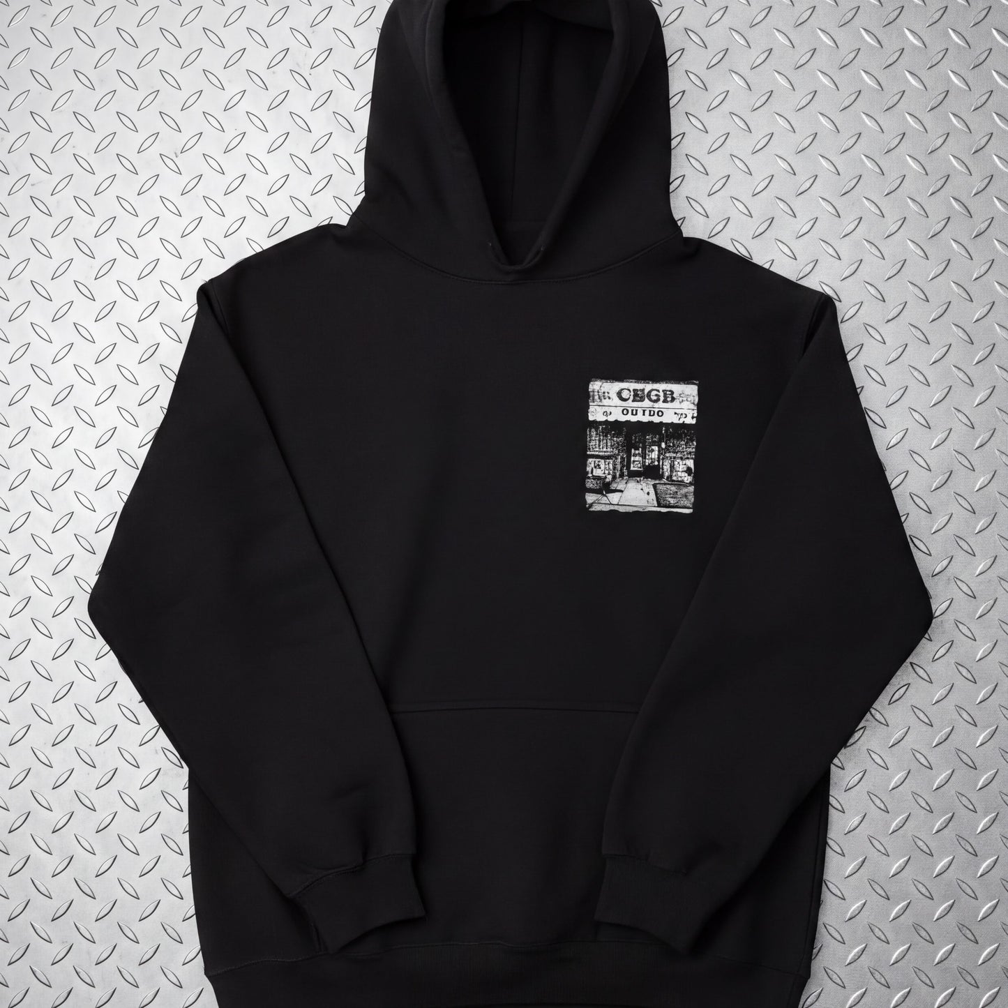 A black hoodie with a graphic design on the front pocket.