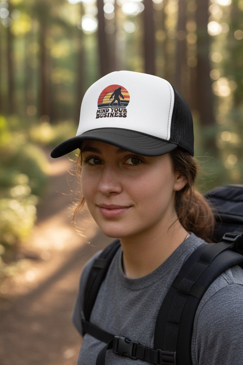 Hats - Mind Your Business Bigfoot Hat | Trucker Cap | Bigfoot, Funny from Crypto Zoo Tees
